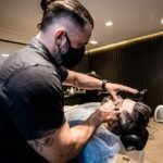 Barber doing a fade haircut in Surrey at Fade Club